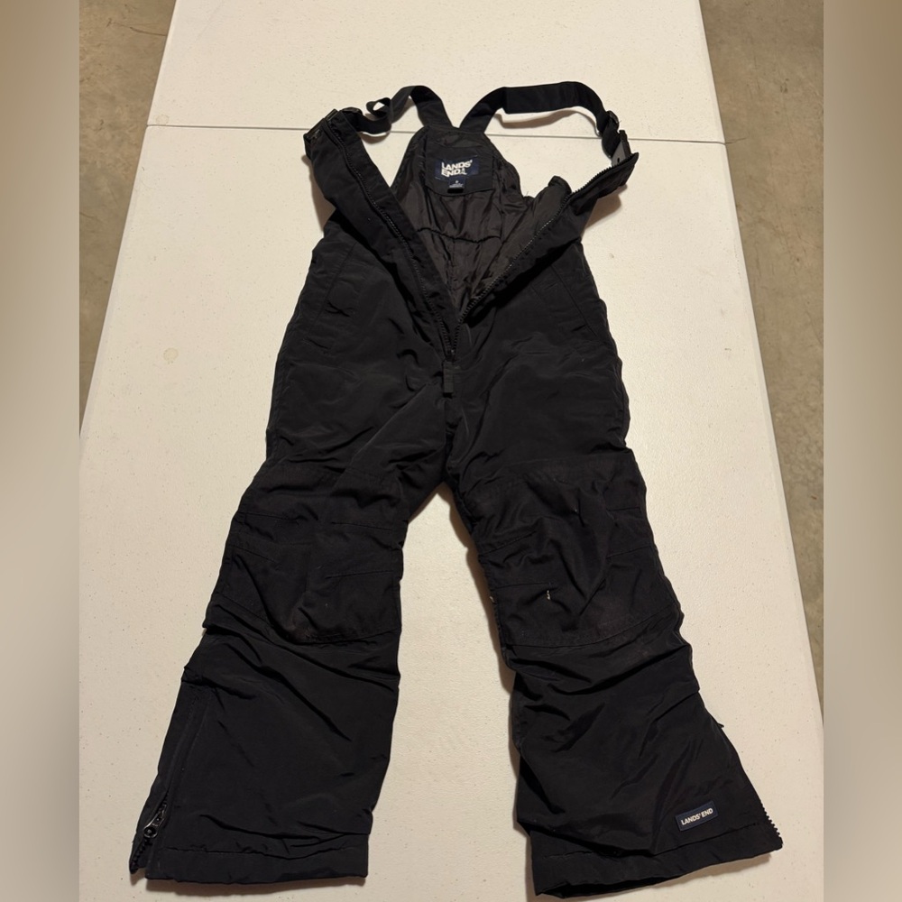 Lands’ Ends kids snow pants size 5 black. These were worn for one season.